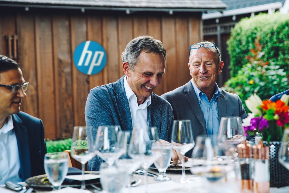 Mark Thompson in conversation over dinner at an HP leadership gathering